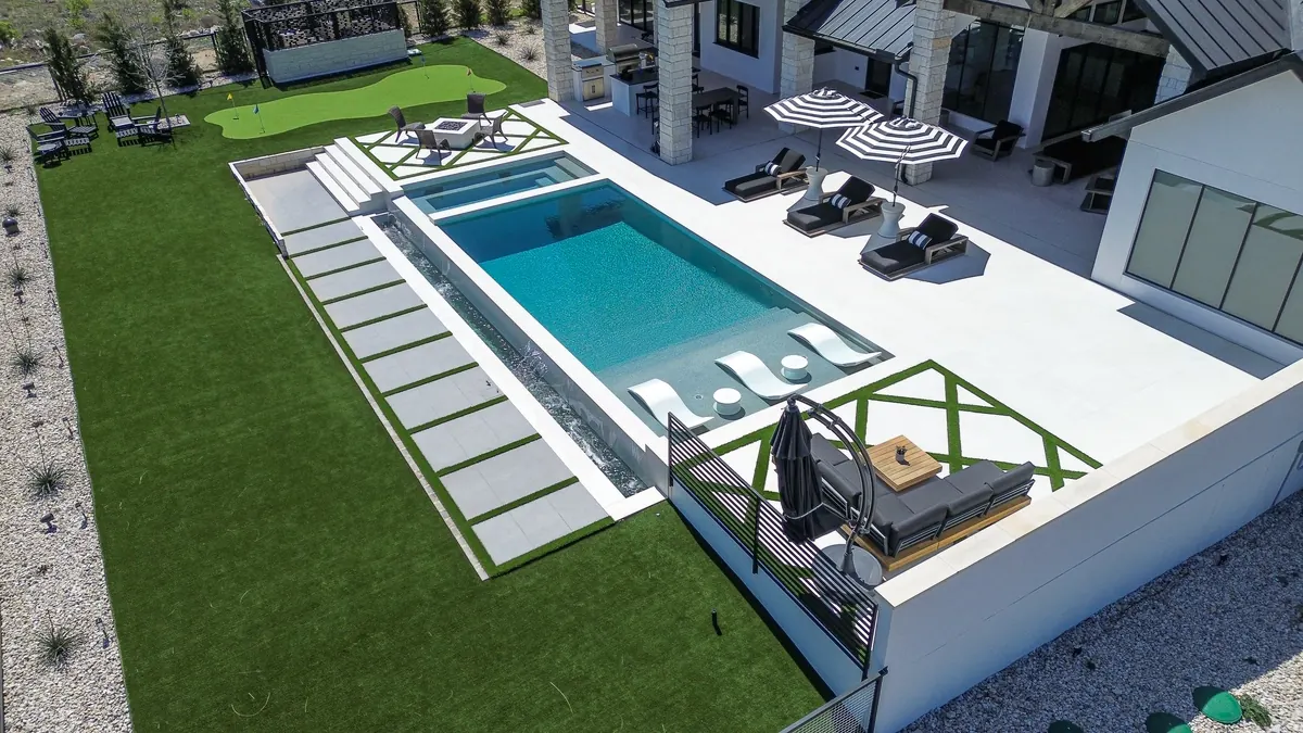 Aerial view of the pool, spa, sun shelf and outdoor seating