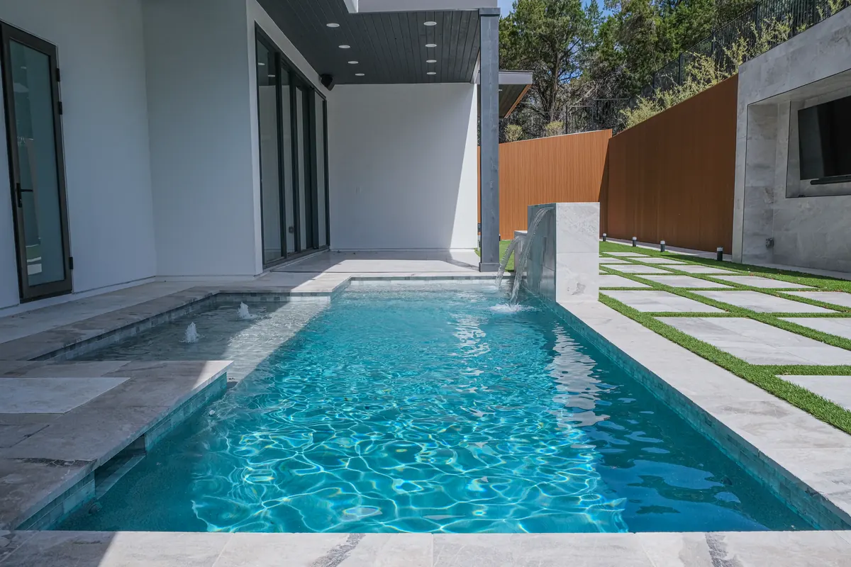 Modern courtyard pool and waterfall wall